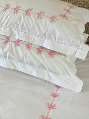 Hand embroidered bedlinen palm leaf border