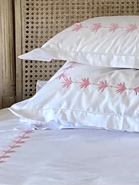 Hand embroidered bedlinen palm leaf border
