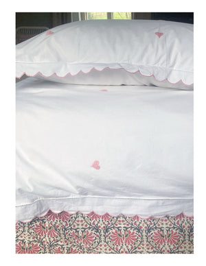 Scalloped bed linen with embroidered hearts
