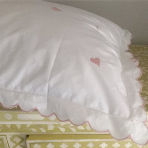 Scalloped bed linen with embroidered hearts
